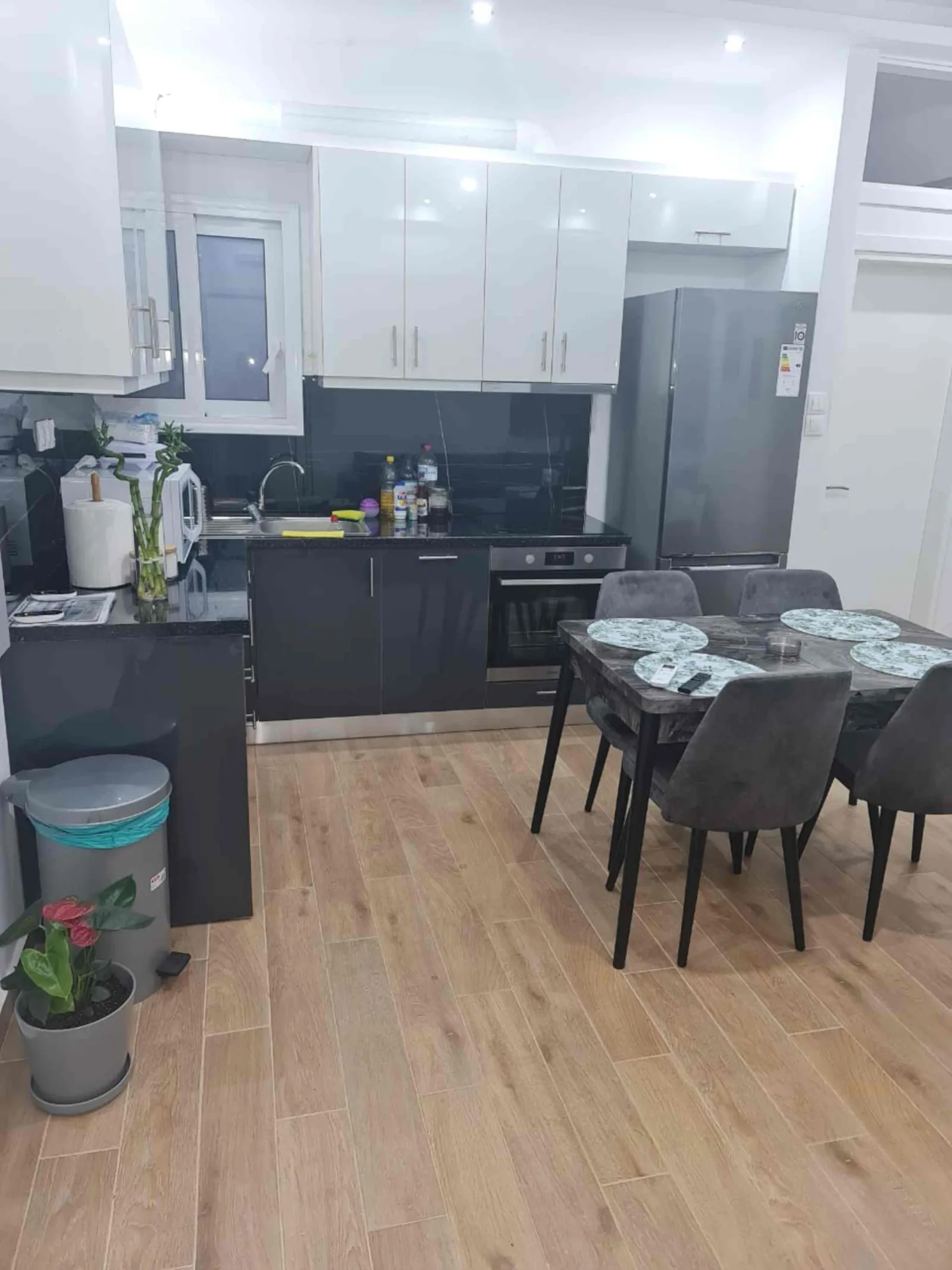 Open kitchen and dining space with wooden floor